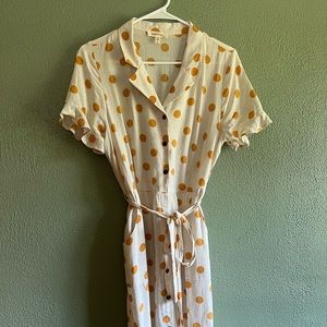 Yellow polka dot button-up tie dress with ruffle sleeves